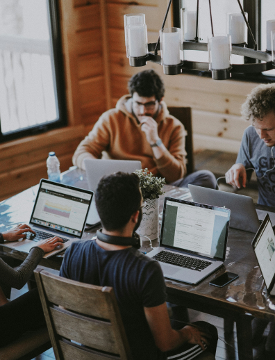 Computer users gathered at a a group of desks
